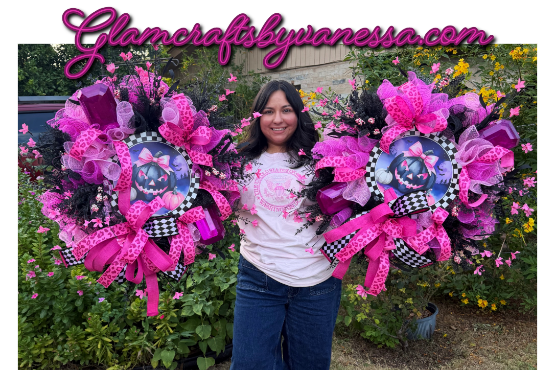 A woman stands outdoors in a garden holding two very large, elaborate floral bouquets in bright pink, purple, black, and white with checkered accents. A pink script watermark reading 'Glamcraftbyvanessa.